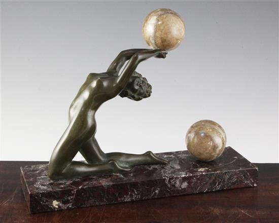 O. Cipriani. A bronze and marble figure of a nude female acrobat with two balls, height 10.5in. width 13.5in.